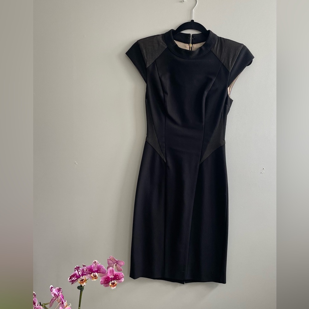 Fitted black ABS dress. Size XS.